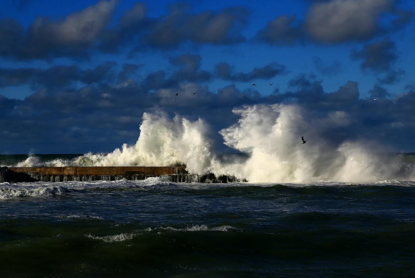 waves crashing onto shore
